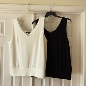 Two Boston Proper Beyond Travel sleeveless blouson tops.